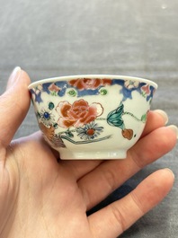 Three Chinese famille rose cups and saucers with a duck among flowering branches, Yongzheng/Qianlong