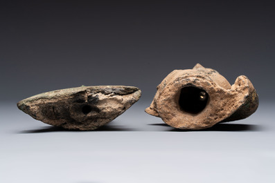 Three Southeast Asian bronze Buddhas and a stone head of Buddha, 18th C.