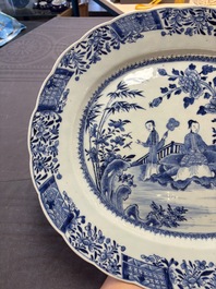 A Chinese blue and white 'ladies in a garden' serving dish, Qianlong