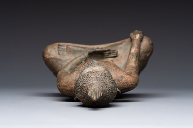 Three Southeast Asian bronze Buddhas and a stone head of Buddha, 18th C.