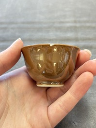 Four Chinese blue and white capucin-ground cups and saucers with landscape design, Yongzheng