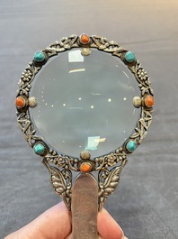 A Chinese silver-mounted magnifying glass with jade handle and precious stone inlays, 19th C.