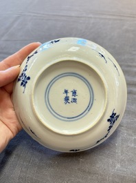 Five Chinese blue and white cups and saucers, Kangxi mark, 19th C.