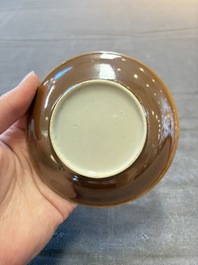 Four Chinese blue and white capucin-ground cups and saucers with landscape design, Yongzheng