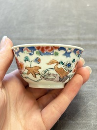 Three Chinese famille rose cups and saucers with a duck among flowering branches, Yongzheng/Qianlong