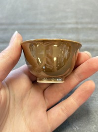 Four Chinese blue and white capucin-ground cups and saucers with landscape design, Yongzheng