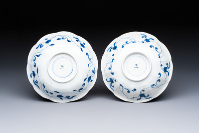 A pair of Chinese blue and white flower-shaped 'Long Eliza' plates, jade mark, Kangxi