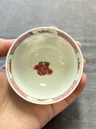 Three Chinese famille rose cups and saucers with a duck among flowering branches, Yongzheng/Qianlong