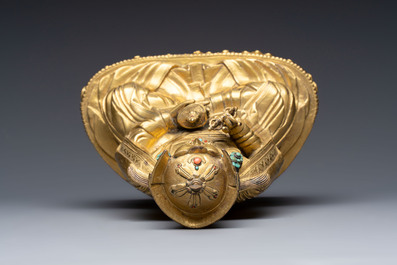 A Tibetan gilt-bronze figure of Padmasambhava holding a cup and a vajra, 17th C. or later