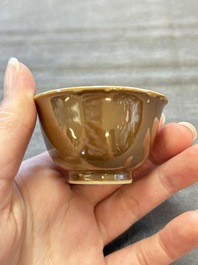Four Chinese blue and white capucin-ground cups and saucers with landscape design, Yongzheng