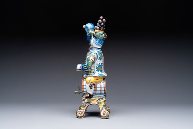 A rare polychrome Dutch Delft figural wine cistern and cover, 18th C.