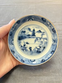 Four Chinese blue and white capucin-ground cups and saucers with landscape design, Yongzheng