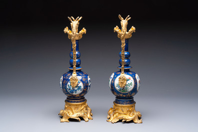 A pair of gilt-bronze-mounted Chinese famille verte powder-blue-ground double gourd vases, 19th C.