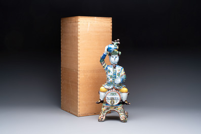 A rare polychrome Dutch Delft figural wine cistern and cover, 18th C.