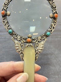 A Chinese silver-mounted magnifying glass with jade handle and precious stone inlays, 19th C.