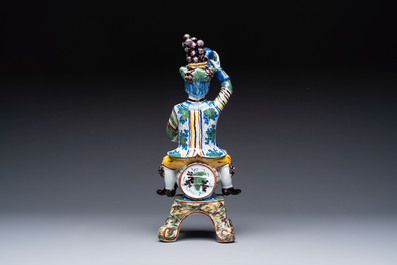 A rare polychrome Dutch Delft figural wine cistern and cover, 18th C.