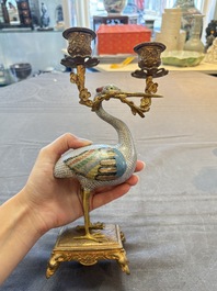 A pair of Chinese cloisonn&eacute; cranes, later mounted as candelabras, 19th C.