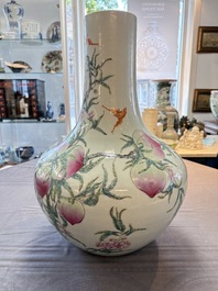 A Chinese famille rose 'nine peaches' 'tianqiuping' vase, Qianlong mark, 19/20th C.