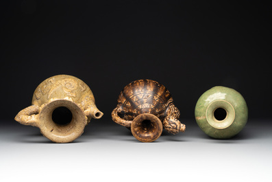 Two Chinese brown-glazed ewers and a celadon-glazed vase, one ewer dated 1571 with a Longqing mark, Qing and later