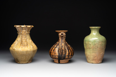 Two Chinese brown-glazed ewers and a celadon-glazed vase, one ewer dated 1571 with a Longqing mark, Qing and later