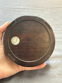 A Chinese carved circular Duan inkstone in a zitan box, signed Dong Jiaozeng 董教增, 18/19th C.