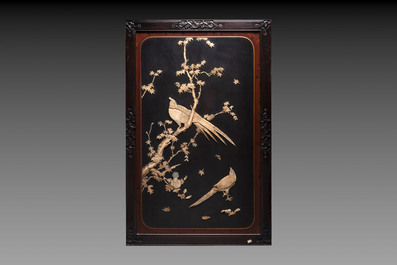 A pair of large Japanese bone-inlaid lacquered wooden panels with birds among flowering branches, 19/20th C.