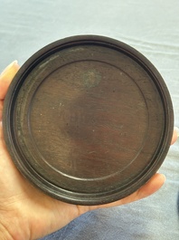 A Chinese carved circular Duan inkstone in a zitan box, signed Dong Jiaozeng 董教增, 18/19th C.