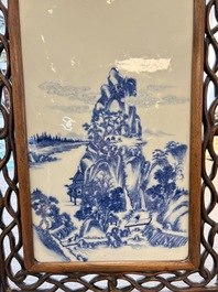 A Chinese blue and white 'mountainous landscape' plaque mounted in a wooden frame, 19/20th C.