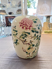 A Chinese blue and white bottle vase and a famille rose 'peaches' jar, 19th C.
