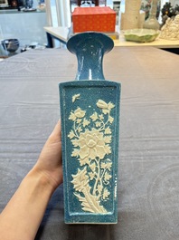 A Chinese robin's egg-glazed vase with relief floral design and a famille noire 'Four Heavenly Kings' vase, 19th C.