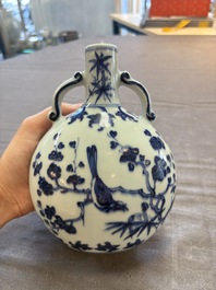 A rare Chinese blue and white 'magpie among flowering branches' moonflask, Yongzheng/Qianlong