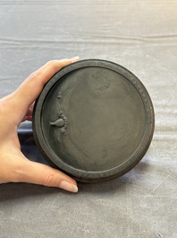 A Chinese carved circular Duan inkstone in a zitan box, signed Dong Jiaozeng 董教增, 18/19th C.
