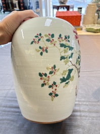 A Chinese blue and white bottle vase and a famille rose 'peaches' jar, 19th C.