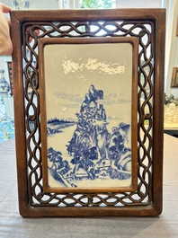 A Chinese blue and white 'mountainous landscape' plaque mounted in a wooden frame, 19/20th C.