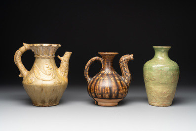 Two Chinese brown-glazed ewers and a celadon-glazed vase, one ewer dated 1571 with a Longqing mark, Qing and later