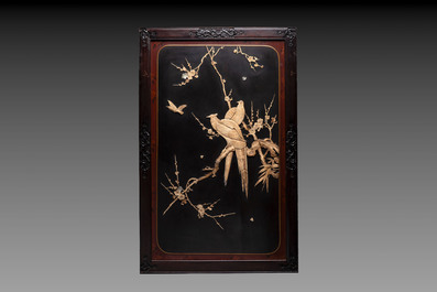 A pair of large Japanese bone-inlaid lacquered wooden panels with birds among flowering branches, 19/20th C.