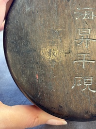 A Chinese carved circular Duan inkstone in a zitan box, signed Dong Jiaozeng 董教增, 18/19th C.