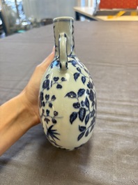 A rare Chinese blue and white 'magpie among flowering branches' moonflask, Yongzheng/Qianlong