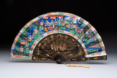 Two Chinese Canton gilt-lacquered and painted paper fans, one with its original box, 19th C.
