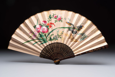 Two Chinese Canton gilt-lacquered and painted paper fans, one with its original box, 19th C.