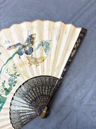 Two Chinese Canton gilt-lacquered and painted paper fans, one with its original box, 19th C.