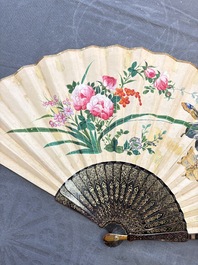 Two Chinese Canton gilt-lacquered and painted paper fans, one with its original box, 19th C.