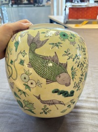 A pair of Chinese verte biscuit 'fish' jars and covers, 19th C.