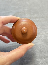 A Chinese Yixing stoneware teapot and cover, 18/19th C.