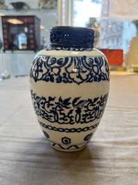 Three Chinese blue and white vases, one with wooden cover, Kangxi