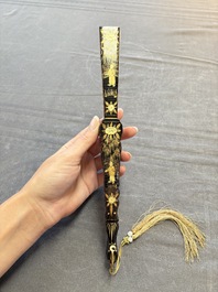 Two Chinese Canton gilt-lacquered and painted paper fans, one with its original box, 19th C.
