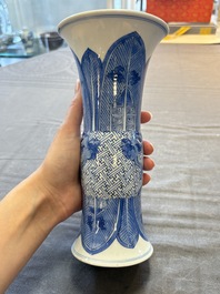 Three Chinese blue and white vases, one with wooden cover, Kangxi