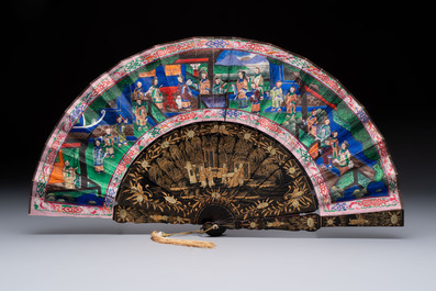 Two Chinese Canton gilt-lacquered and painted paper fans, one with its original box, 19th C.