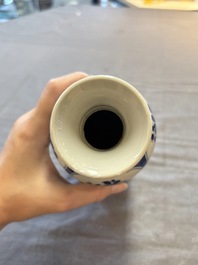 Three Chinese blue and white vases, one with wooden cover, Kangxi