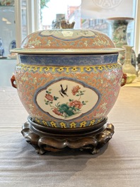 A Chinese famille rose pink-ground 'kamcheng' bowl and cover for the Straits or Peranakan market, on a wooden stand, 19th C.